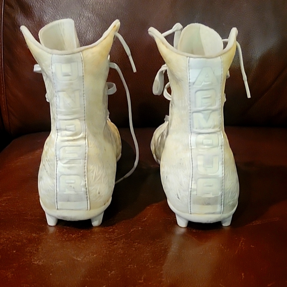 Under Armour high top cleats.  Worn but have plenty of field time left in them.